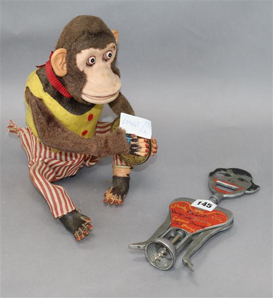 A 1930s novelty bottle opener and a mechanical monkey